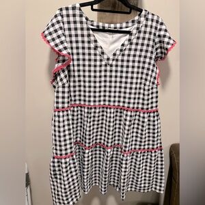 Black & white checker babydoll dress with hot pink trim.